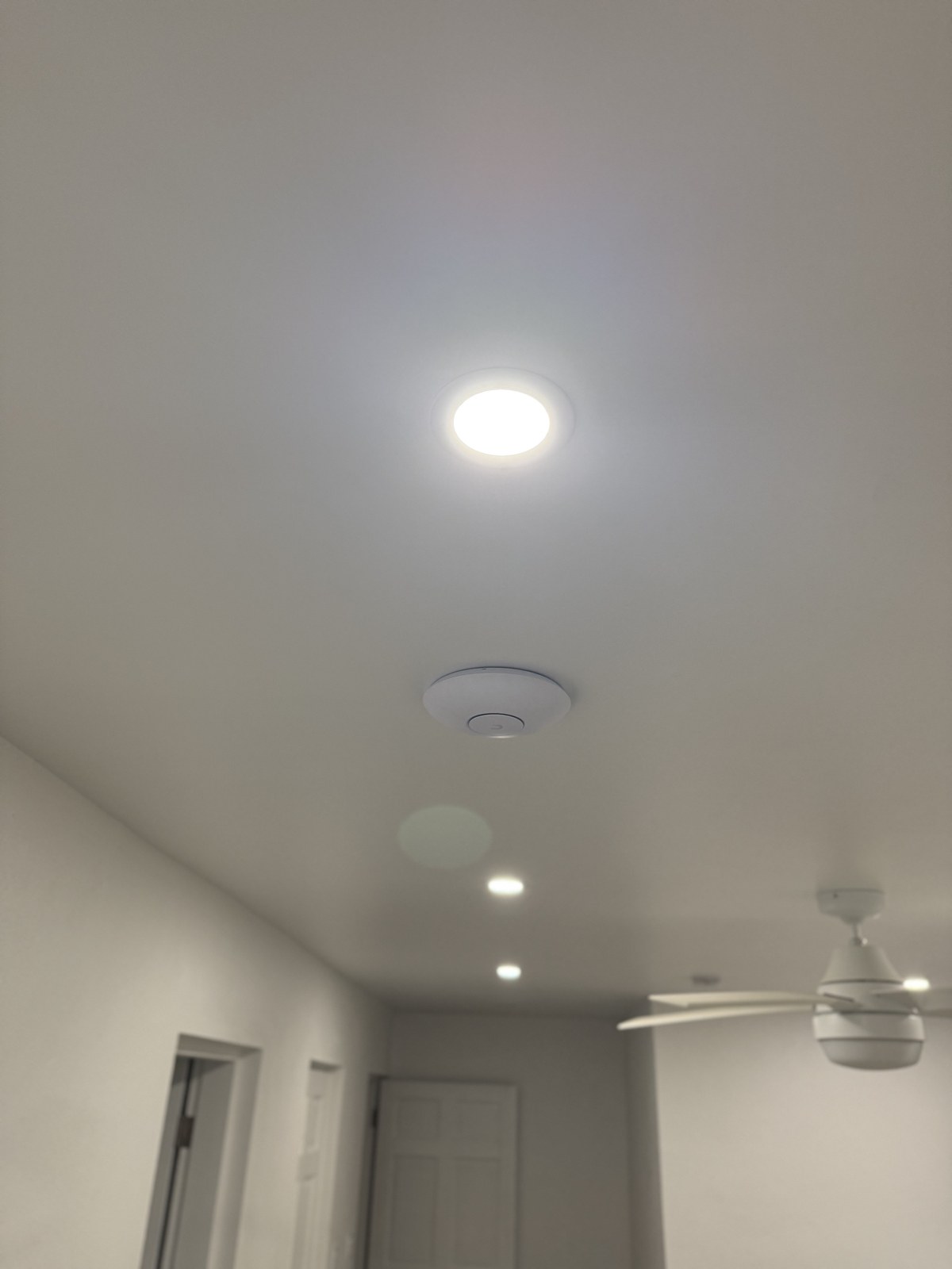 Ceiling access point blending with recessed hallway lighting