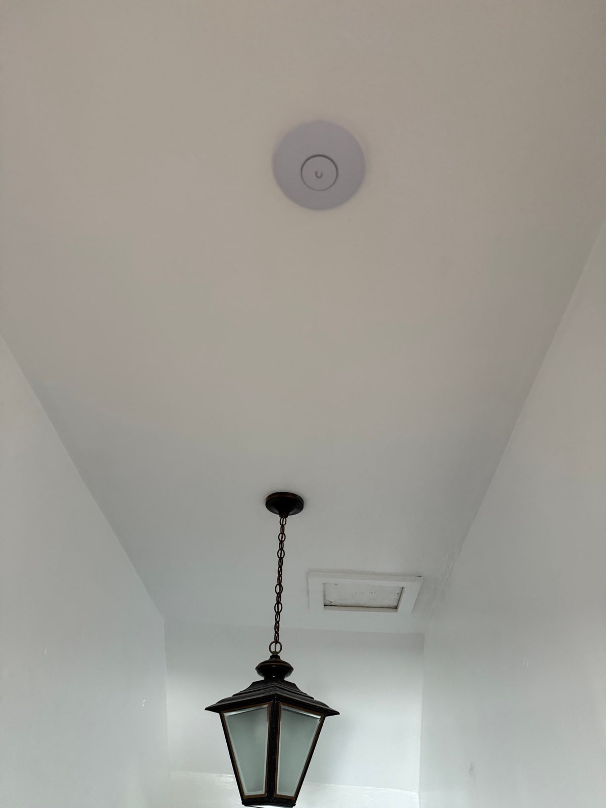Access point discreetly placed next to an entry lantern