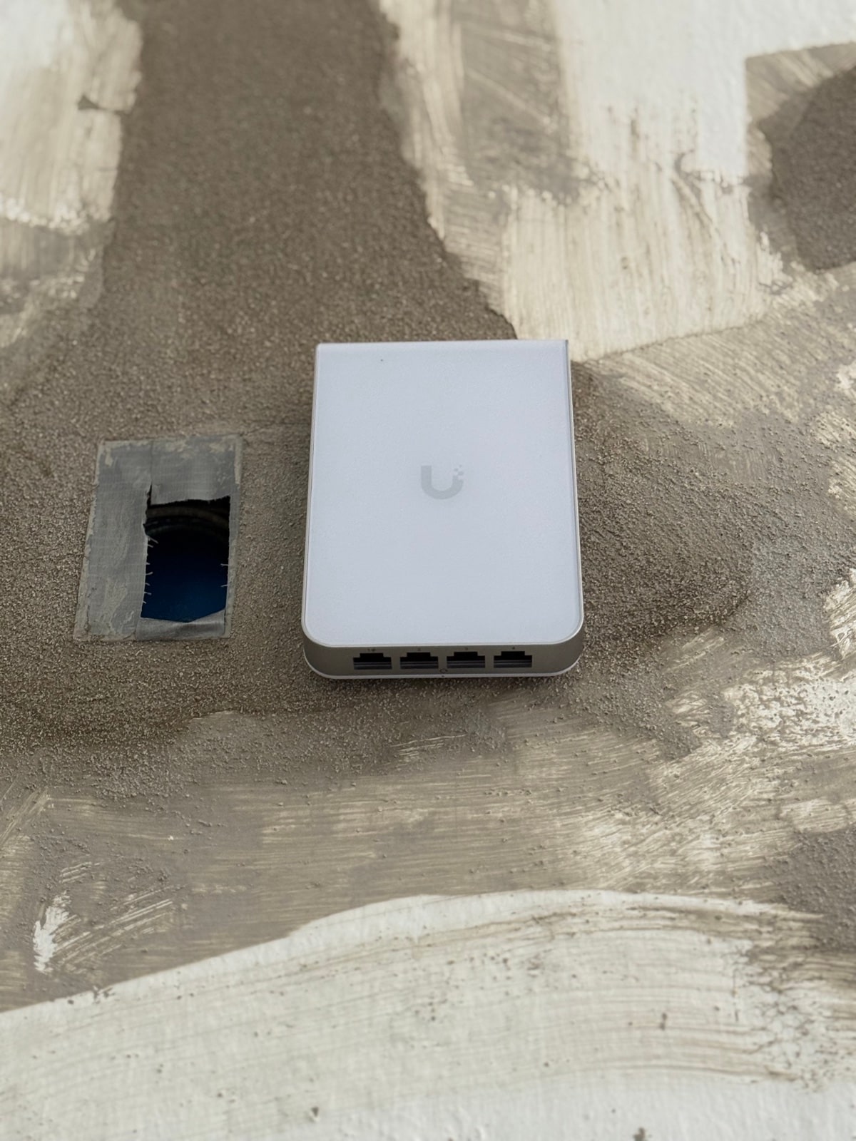 Access point install in progress - cabling tucked behind drywall