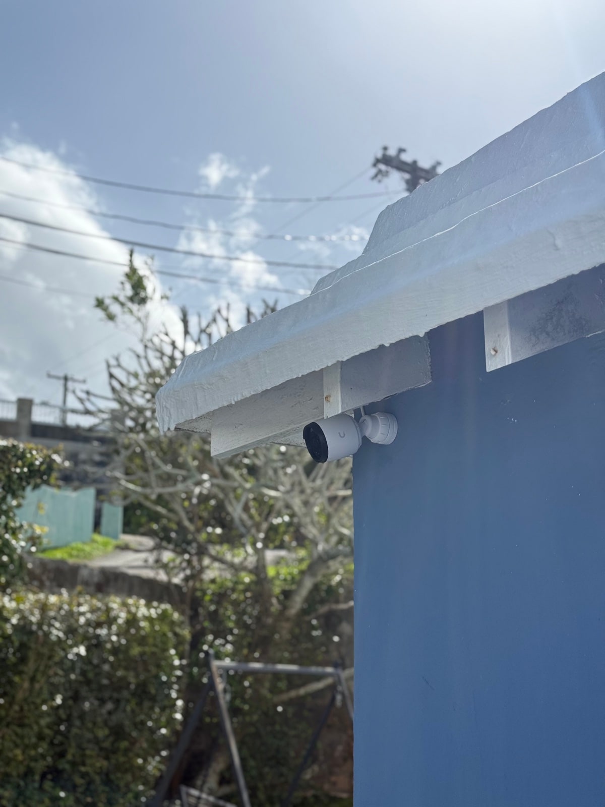 Outdoor bullet camera against open Bermuda sky