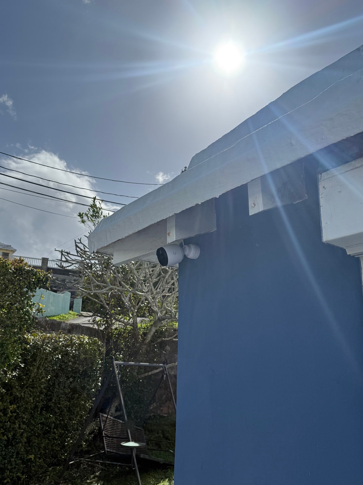 Bullet camera under the eaves with bright daylight