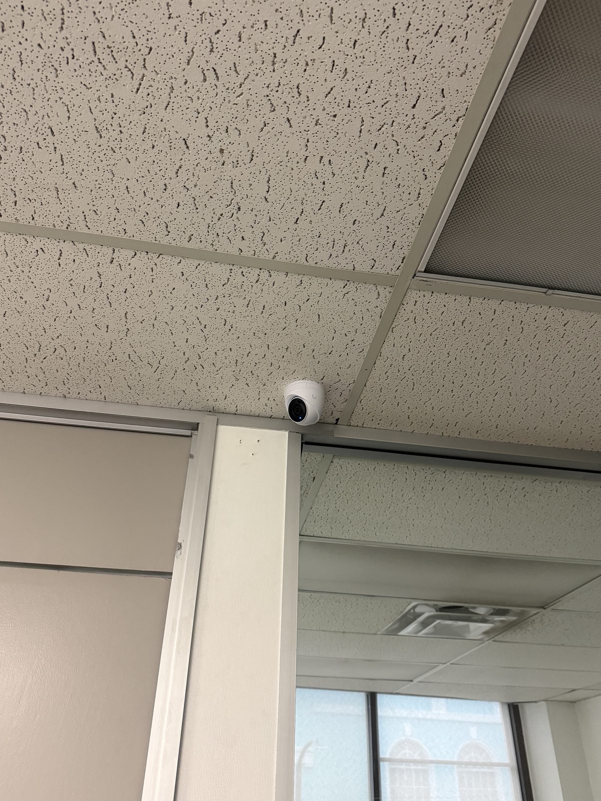 Turret camera tucked into an office corner - full view of the room